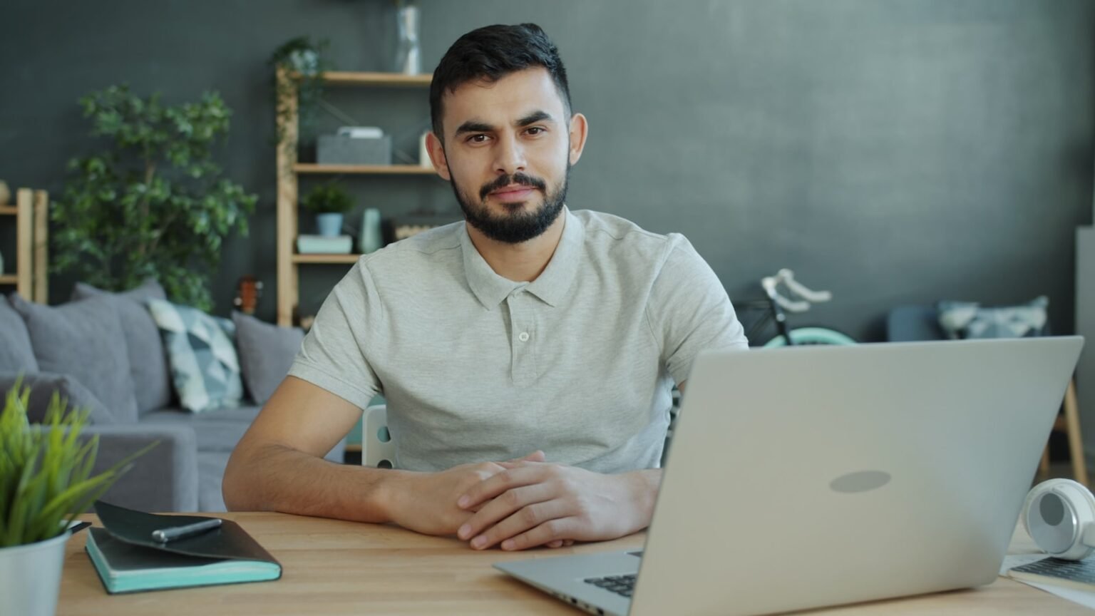 Small business owner at a desk reviewing affordable SEO services options on a laptop