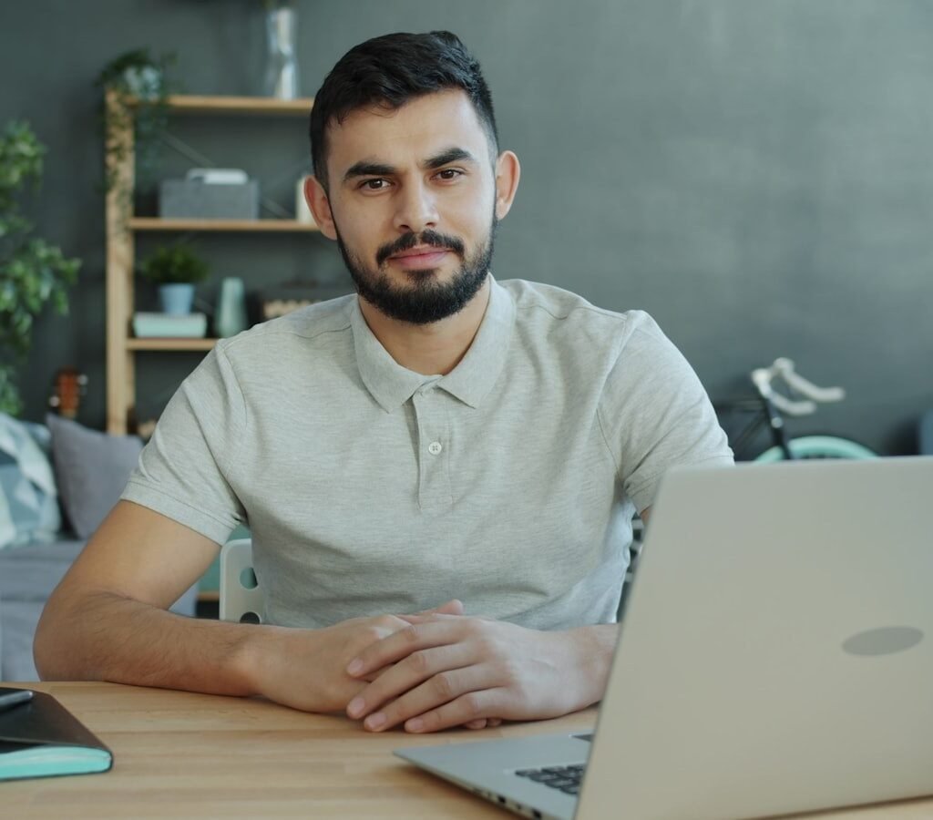Small business owner at a desk reviewing affordable SEO services options on a laptop