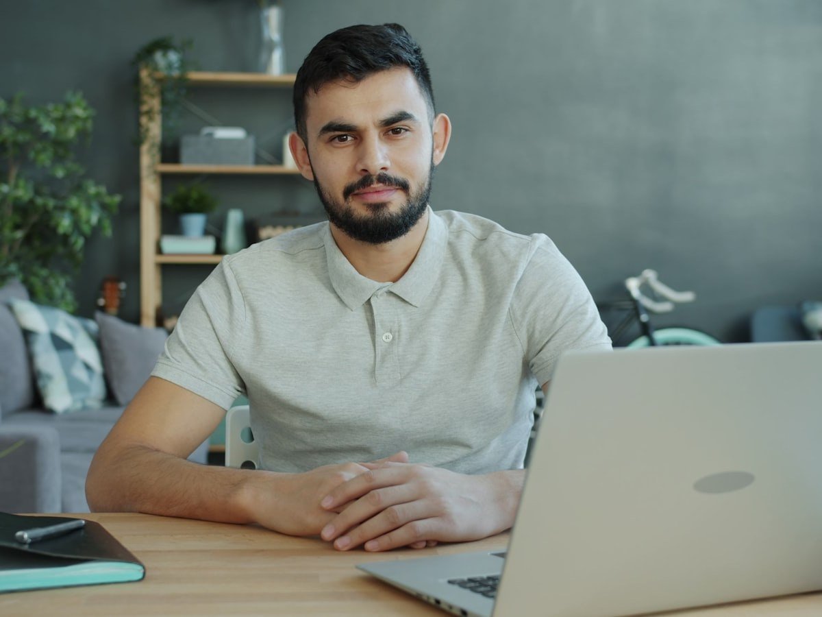 Small business owner at a desk reviewing affordable SEO services options on a laptop