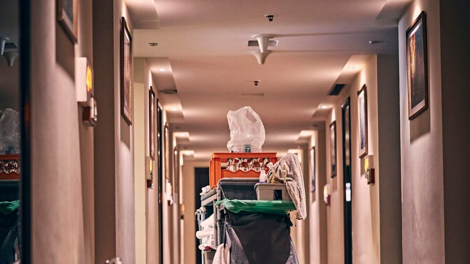 Housekeeping cart in a hotel corridor, representing commercial cleaning contracts won through local SEO